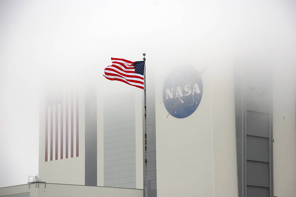 Image of the 525-foot tall Vehicle Assembly Building at NASA’s Kennedy Space Center in Florida with fog.