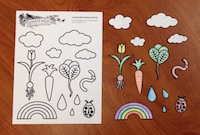 The coloring book print out and colored-in, cut-out shapes.