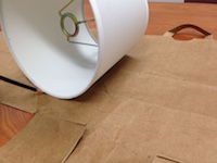 Roll the lampshade along the grocery bag to make your template.